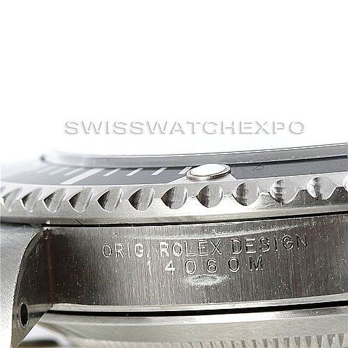The image shows a close-up side view of the Rolex Submariner 14060 Men
s Stainless Steel Black Dial 14060 Men
s Stainless Steel Black Dial, focusing on the case and bezel, highlighting the engraving "ORIG ROLEX DESIGN 14060M."