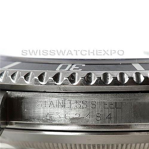 This close-up shows the side of the Rolex Submariner 16610 Men
s Stainless Steel Black Dial 16610 Men
s Stainless Steel Black Dial, highlighting the stainless steel case and partial view of the bezel and dial.