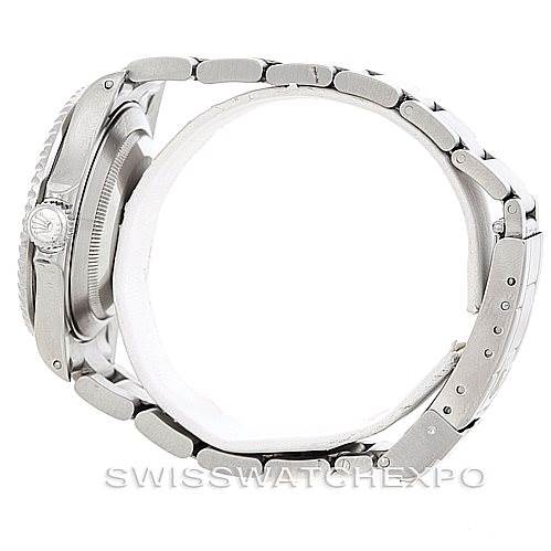 The image shows a side view of a Rolex Submariner 16610 Men
s Stainless Steel Black Dial 16610 Men
s Stainless Steel Black Dial watch, highlighting its profile, case, crown, and bracelet.