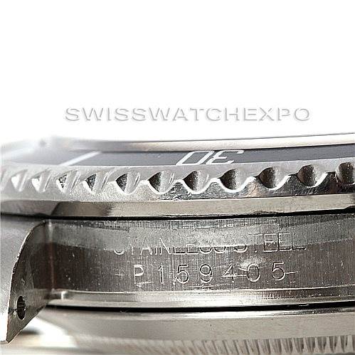 This image shows a close-up side view of the bezel, case, and engraved serial number of a Rolex Submariner 16610 Men
s Stainless Steel Black Dial 16610 Men
s Stainless Steel Black Dial watch.