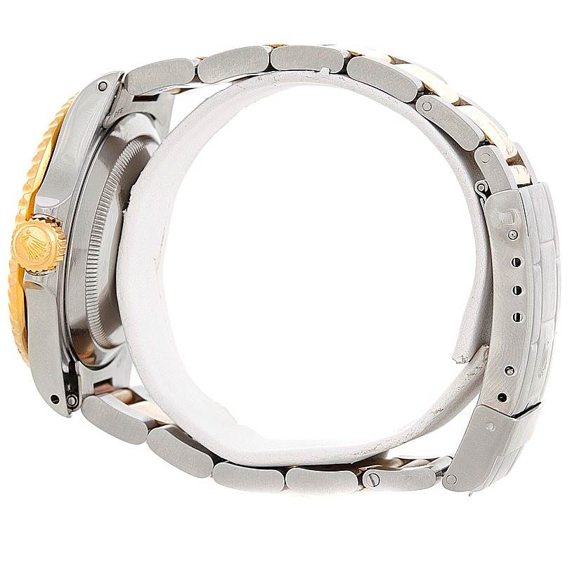 The angle shows a side view of the Rolex Submariner 16613 Men's Steel and Gold (two tone) Black Dial 16613 Men's Steel and Gold (two tone) Black Dial's case, crown, and bracelet.