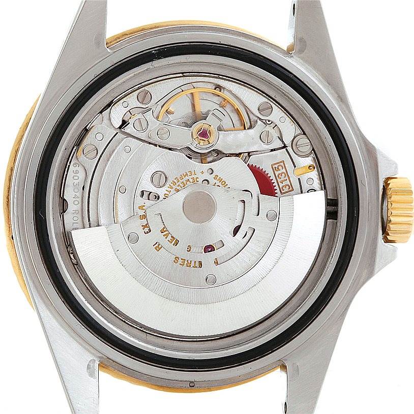 This is the back view of the Rolex Submariner 16613 Men's Steel and Gold (two tone) Black Dial 16613 Men's Steel and Gold (two tone) Black Dial, showing the intricate internal mechanical movement.
