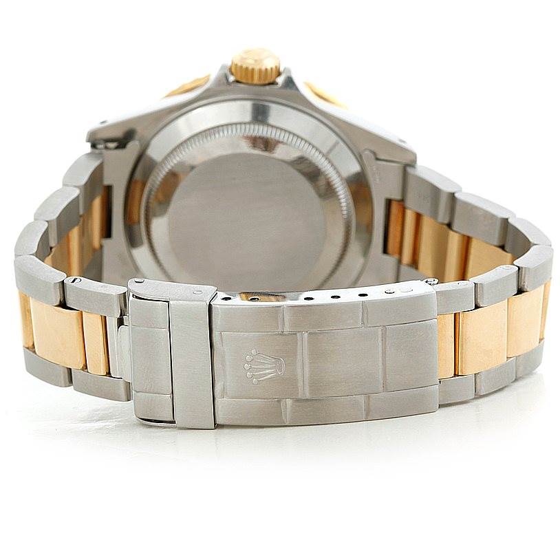 The image shows the back view and clasp of a Rolex Submariner 16613 Men's Steel and Gold (two tone) Black Dial 16613 Men's Steel and Gold (two tone) Black Dial watch with a two-tone bracelet.