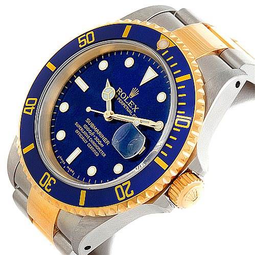 The image shows a Rolex Submariner 16613 Men's Steel and Gold (two tone) Blue Dial 16613 Men's Steel and Gold (two tone) Blue Dial watch at an angled view, highlighting the face, bezel, crown, and part of the two-tone bracelet.