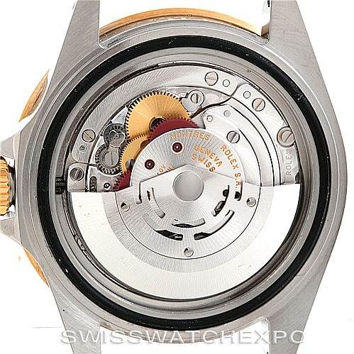 The image shows the movement and inner mechanism of the Rolex Submariner 16613 Men's Steel and Gold (two tone) Blue Dial 16613 Men's Steel and Gold (two tone) Blue Dial watch from a rear angle.