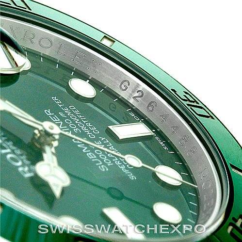 The image shows a close-up of the Rolex Submariner 116610LV Men's Stainless Steel Green Dial 116610LV Men's Stainless Steel Green Dial watch face and part of the bezel, highlighting the serial number on the inner ring.