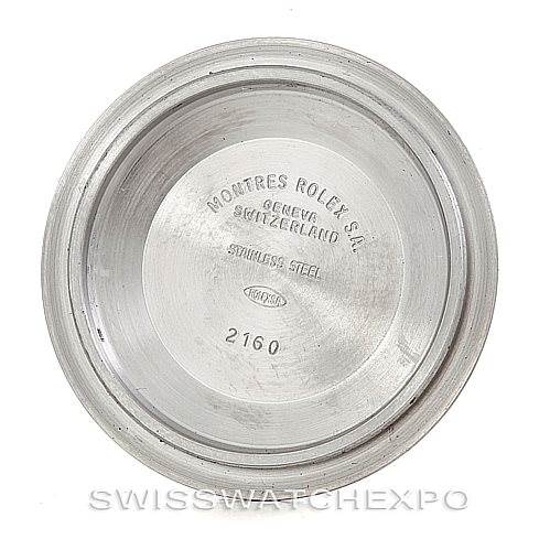 This image shows the interior of the case back of a Rolex Submariner 16610 Men's Stainless Steel Black Dial 16610 Men's Stainless Steel Black Dial watch, displaying model information and branding.