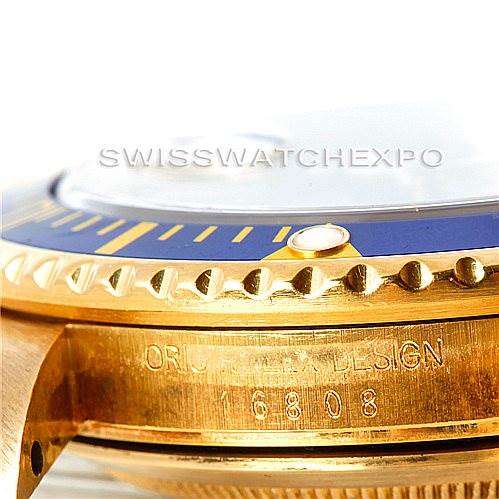 This close-up image shows the side profile of the bezel and case of a Rolex Submariner 16808 Men's Yellow Gold Blue Dial 16808 Men's Yellow Gold Blue Dial watch.