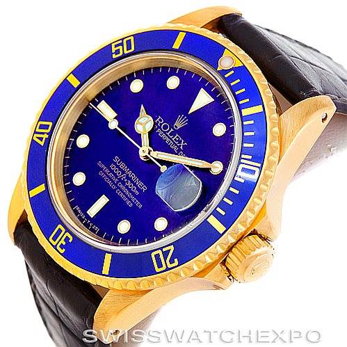 The image shows a Rolex Submariner 16808 Men's Yellow Gold Blue Dial 16808 Men's Yellow Gold Blue Dial watch angled to display the face, crown, and part of the strap.