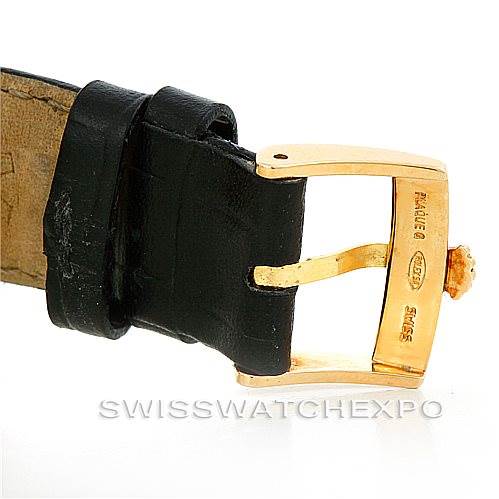 The image shows a gold buckle and part of the black leather strap for a Rolex Submariner 16808 Men's Yellow Gold Blue Dial 16808 Men's Yellow Gold Blue Dial watch.
