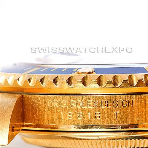 The image shows a close-up side view of the bezel and engraved case side of a Rolex Submariner 16618 Men's Yellow Gold Blue Dial 16618 Men's Yellow Gold Blue Dial, model 16618T.