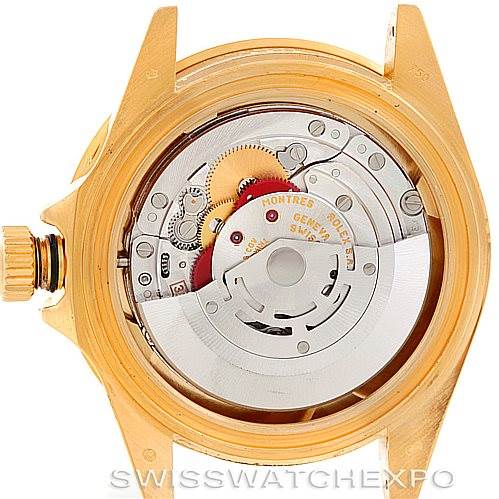 The image shows the inner mechanical components of a Rolex Submariner 16618 Men's Yellow Gold Blue Dial 16618 Men's Yellow Gold Blue Dial watch with the case back removed.