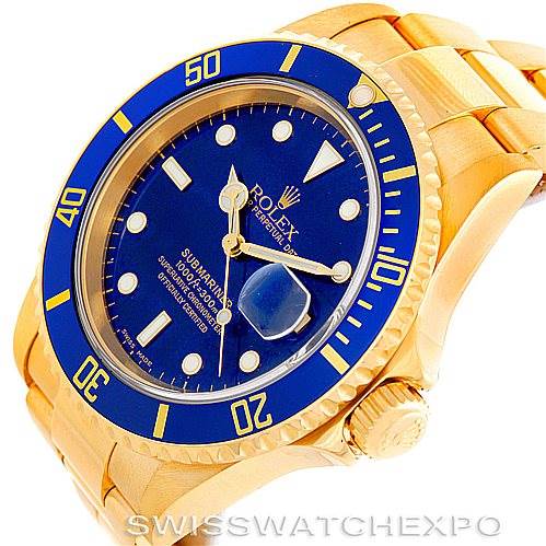 The image shows a Rolex Submariner 16618 Men's Yellow Gold Blue Dial 16618 Men's Yellow Gold Blue Dial watch at an oblique angle, capturing the dial, bezel, crown, and part of the bracelet.