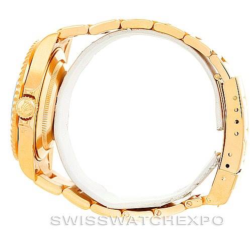 This image shows a side view of a Rolex Submariner 16618 Men's Yellow Gold Blue Dial 16618 Men's Yellow Gold Blue Dial watch, highlighting its gold case, crown, and bracelet.