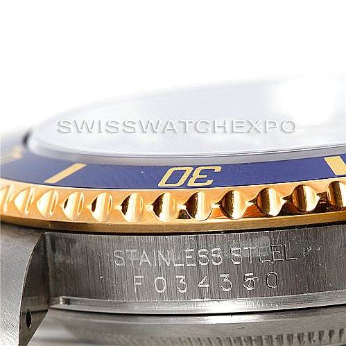 Close-up side view of the bezel and casing of a Rolex Submariner 16613 Men's Steel and Gold (two tone) Blue Dial 16613 Men's Steel and Gold (two tone) Blue Dial watch, highlighting the gold and stainless steel parts.