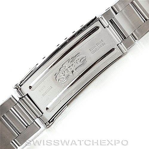 The image shows a close-up view of the clasp and bracelet of a Rolex Submariner 14060 Men's Stainless Steel Black Dial 14060 Men's Stainless Steel Black Dial watch, displaying the brand engraving.