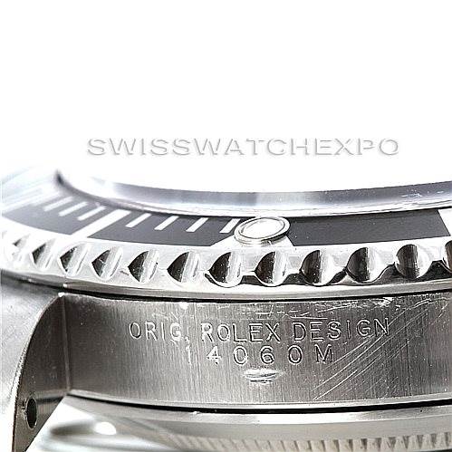 This image shows a close-up of the bezel and the case side of a Rolex Submariner 14060 Men's Stainless Steel Black Dial 14060 Men's Stainless Steel Black Dial watch, highlighting the engraved model details.