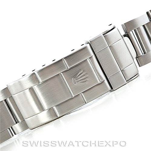 This image shows the clasp of a Rolex Submariner 14060 Men's Stainless Steel Black Dial 14060 Men's Stainless Steel Black Dial stainless steel bracelet from a side angle.