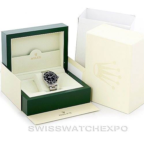 The image displays a Rolex Submariner 16610 Men's Stainless Steel Black Dial 16610 Men's Stainless Steel Black Dial watch inside its open green Rolex box, next to its outer cream-colored packaging.