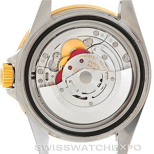 The image shows the Rolex Submariner 16613 Men's Steel and Gold (two tone) Grey Dial 16613 Men's Steel and Gold (two tone) Grey Dial watch's movement from the back, revealing its internal mechanical components.