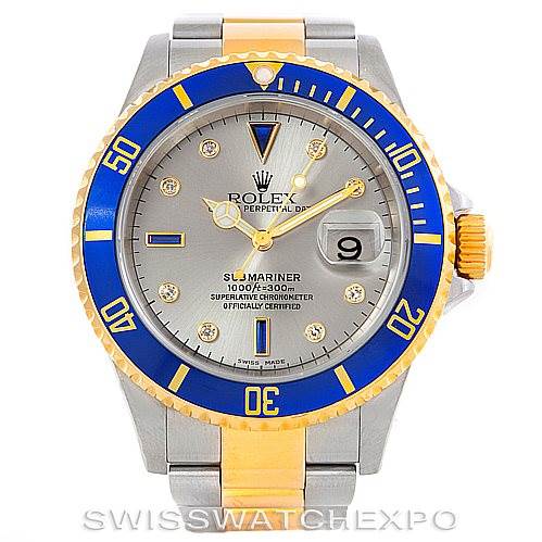 The image shows a front view of a Rolex Submariner 16613 Men's Steel and Gold (two tone) Grey Dial 16613 Men's Steel and Gold (two tone) Grey Dial watch with a gray dial, blue and gold bezel, and a stainless steel and gold bracelet.
