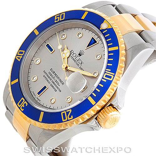 The image shows the side and face of the Rolex Submariner 16613 Men's Steel and Gold (two tone) Grey Dial 16613 Men's Steel and Gold (two tone) Grey Dial, highlighting the bezel, dial, hands, and crown.