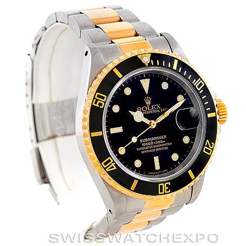 The image shows a Rolex Submariner 16613 Men
s Steel and Gold (two tone) Black Dial 16613 Men
s Steel and Gold (two tone) Black Dial watch facing slightly to the left, displaying its dial, bezel, and two-tone bracelet.