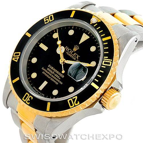 The image shows a Rolex Submariner 16613 Men
s Steel and Gold (two tone) Black Dial 16613 Men
s Steel and Gold (two tone) Black Dial watch at a slight angle, highlighting its face, bezel, crown, and part of the bracelet.