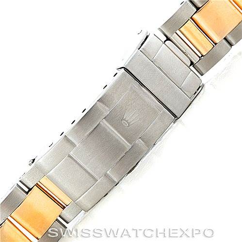 The image shows a close-up of a two-tone bracelet from a Rolex Submariner 16613 Men
s Steel and Gold (two tone) Black Dial 16613 Men
s Steel and Gold (two tone) Black Dial, displaying the clasp and part of the links.