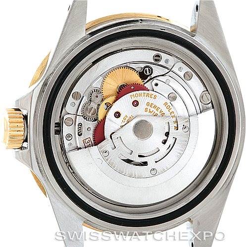 This image shows the inner mechanics and movement of a Rolex Submariner 16613 Men
s Steel and Gold (two tone) Black Dial 16613 Men
s Steel and Gold (two tone) Black Dial watch from a rear angle with the back case removed.