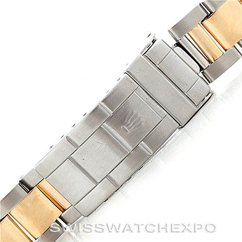 The image shows a close-up, top view of the clasp and metal bracelet of a Rolex Submariner 16613 Men's Steel and Gold (two tone) Blue Dial 16613 Men's Steel and Gold (two tone) Blue Dial watch.