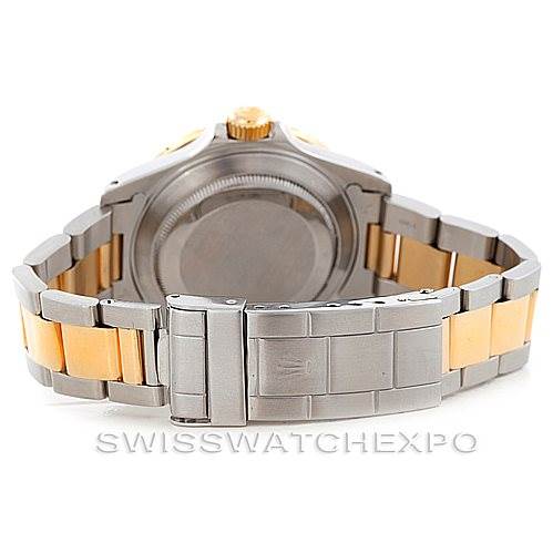 The image shows the back view of a Rolex Submariner 16613 Men's Steel and Gold (two tone) Blue Dial 16613 Men's Steel and Gold (two tone) Blue Dial watch, highlighting the bracelet and clasp in silver and gold tones.