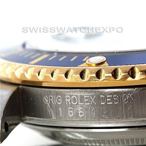 The image shows a close-up of the side of a Rolex Submariner 16613 Men's Steel and Gold (two tone) Blue Dial 16613 Men's Steel and Gold (two tone) Blue Dial watch, highlighting the bezel, case, and the "ORIG ROLEX DESIGN 16613" engraving.