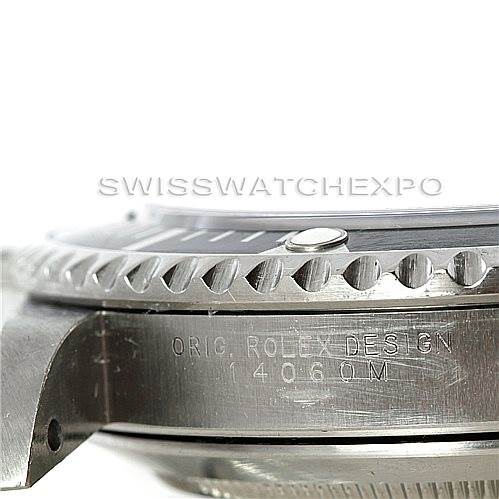 This image shows a close-up of the side and bezel of a Rolex Submariner 14060 Men's Stainless Steel Black Dial 14060 Men's Stainless Steel Black Dial, with "ORIG. ROLEX DESIGN 14060M" engraved on the side.