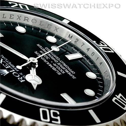 The image shows a close-up angle of the Rolex Submariner 14060 Men's Stainless Steel Black Dial 14060 Men's Stainless Steel Black Dial watch face, focusing on the bezel, crown, and dial details.