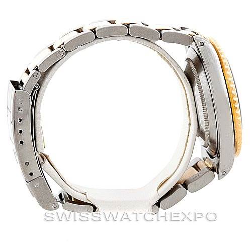 This image shows a side view of the Rolex Submariner 16613 Men
s Steel and Gold (two tone) Blue Dial 16613 Men
s Steel and Gold (two tone) Blue Dial watch, highlighting its metal band, side profile, and the crown.