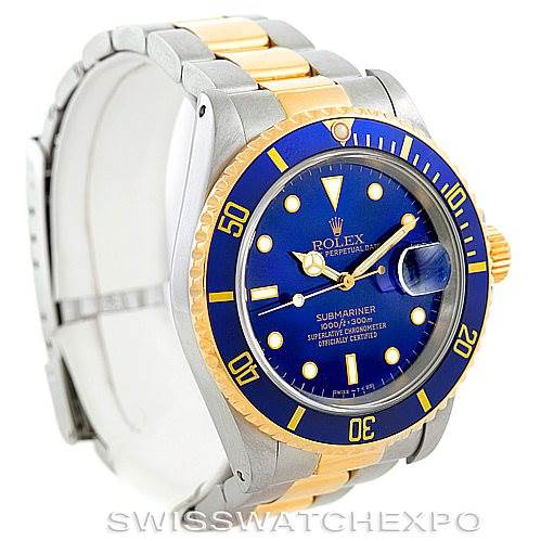 The Rolex Submariner 16613 Men
s Steel and Gold (two tone) Blue Dial 16613 Men
s Steel and Gold (two tone) Blue Dial watch is displayed at an angle showing the dial, bezel, case, and part of the bracelet.