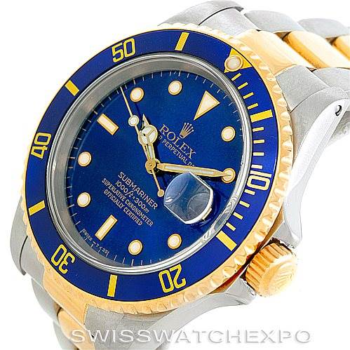 This image shows a close-up of a Rolex Submariner 16613 Men
s Steel and Gold (two tone) Blue Dial 16613 Men
s Steel and Gold (two tone) Blue Dial watch, highlighting the face, bezel, and part of the bracelet.