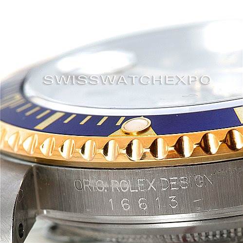 The image shows a close-up of the side and bezel of a Rolex Submariner 16613 Men's Steel and Gold (two tone) Grey Dial 16613 Men's Steel and Gold (two tone) Grey Dial model, highlighting the "ORIG. ROLEX DESIGN" engraving and part of the bezel.