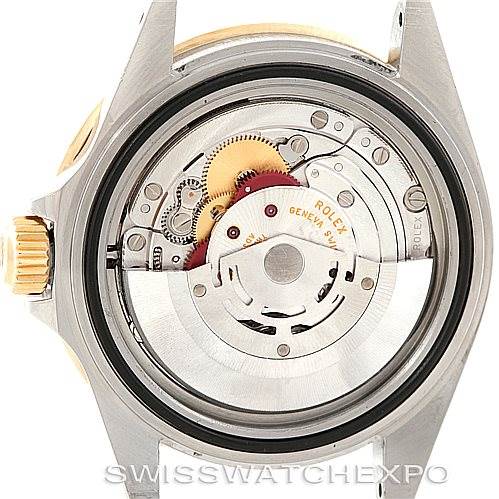 This image shows the internal movement of a Rolex Submariner 16613 Men's Steel and Gold (two tone) Grey Dial 16613 Men's Steel and Gold (two tone) Grey Dial watch from the back, with gears and components visible.