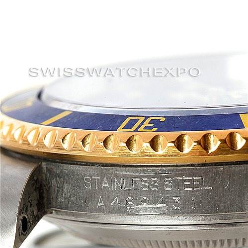 This close-up angle shows the edge of the bezel and part of the engraving on the case of a Rolex Submariner 16613 Men
s Steel and Gold (two tone) Blue Dial 16613 Men
s Steel and Gold (two tone) Blue Dial.