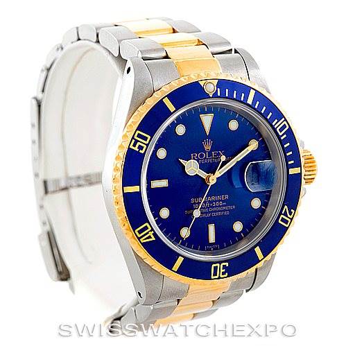 The image shows a Rolex Submariner 16613 Men
s Steel and Gold (two tone) Blue Dial 16613 Men
s Steel and Gold (two tone) Blue Dial watch with a blue dial, gold and silver bracelet, angled slightly from the front-left side.