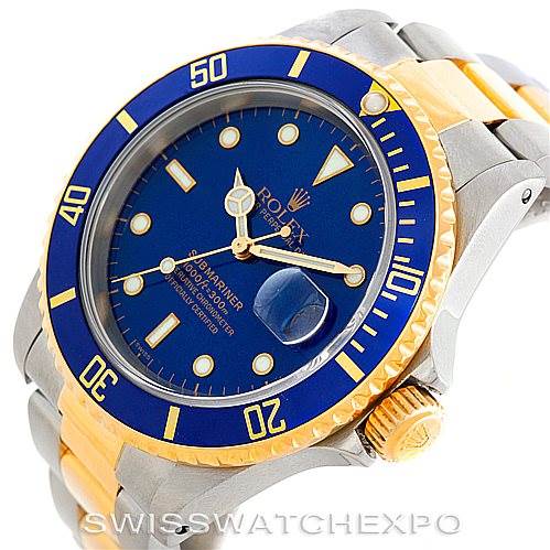 This image shows a close-up of a Rolex Submariner 16613 Men
s Steel and Gold (two tone) Blue Dial 16613 Men
s Steel and Gold (two tone) Blue Dial watch, featuring its blue dial, gold accents, and bi-metal band.