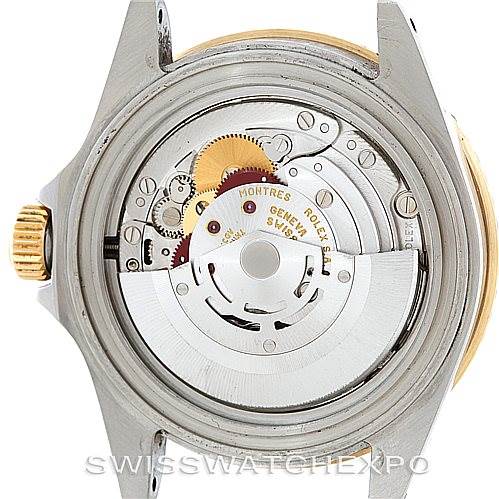 The image shows the internal movement and mechanics of a Rolex Submariner 16613 Men
s Steel and Gold (two tone) Blue Dial 16613 Men
s Steel and Gold (two tone) Blue Dial watch from a rear angle with the case back removed.
