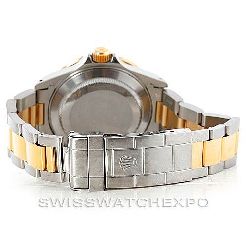 The image shows the back of a Rolex Submariner 16613 Men
s Steel and Gold (two tone) Blue Dial 16613 Men
s Steel and Gold (two tone) Blue Dial watch, highlighting the case back, bracelet, and clasp.