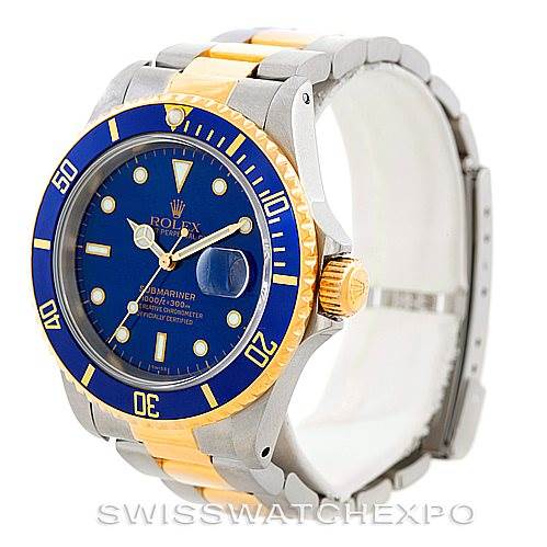 The image shows a Rolex Submariner 16613 Men
s Steel and Gold (two tone) Blue Dial 16613 Men
s Steel and Gold (two tone) Blue Dial watch at a three-quarter angle, highlighting its blue dial, two-tone band, and bezel.