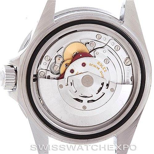 This image is a close-up of the back of a Rolex Submariner 16610 Men's Stainless Steel Black Dial 16610 Men's Stainless Steel Black Dial watch showing its internal mechanism and gears.