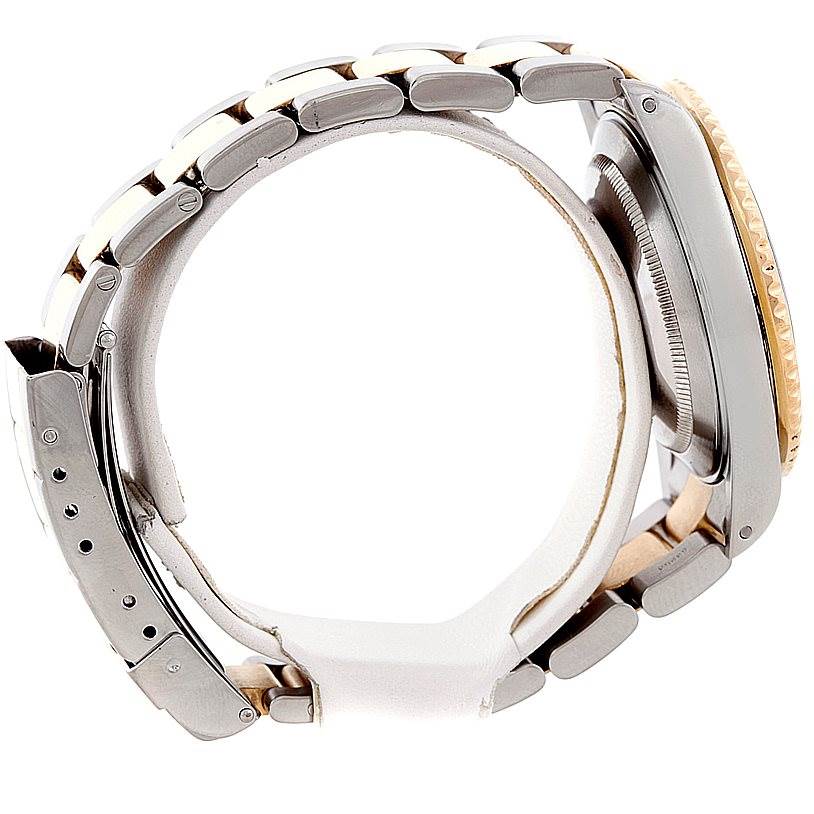 The image shows a side view of a Rolex Submariner 16613 Men's Steel and Gold (two tone) Champagne Dial 16613 Men's Steel and Gold (two tone) Champagne Dial watch, highlighting its case, crown, and metallic bracelet.