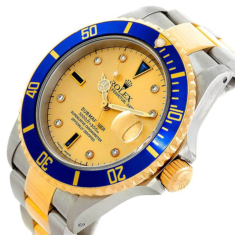 This image shows a side view angle of a Rolex Submariner 16613 Men's Steel and Gold (two tone) Champagne Dial 16613 Men's Steel and Gold (two tone) Champagne Dial, highlighting the bezel, dial, crown, and partial bracelet.