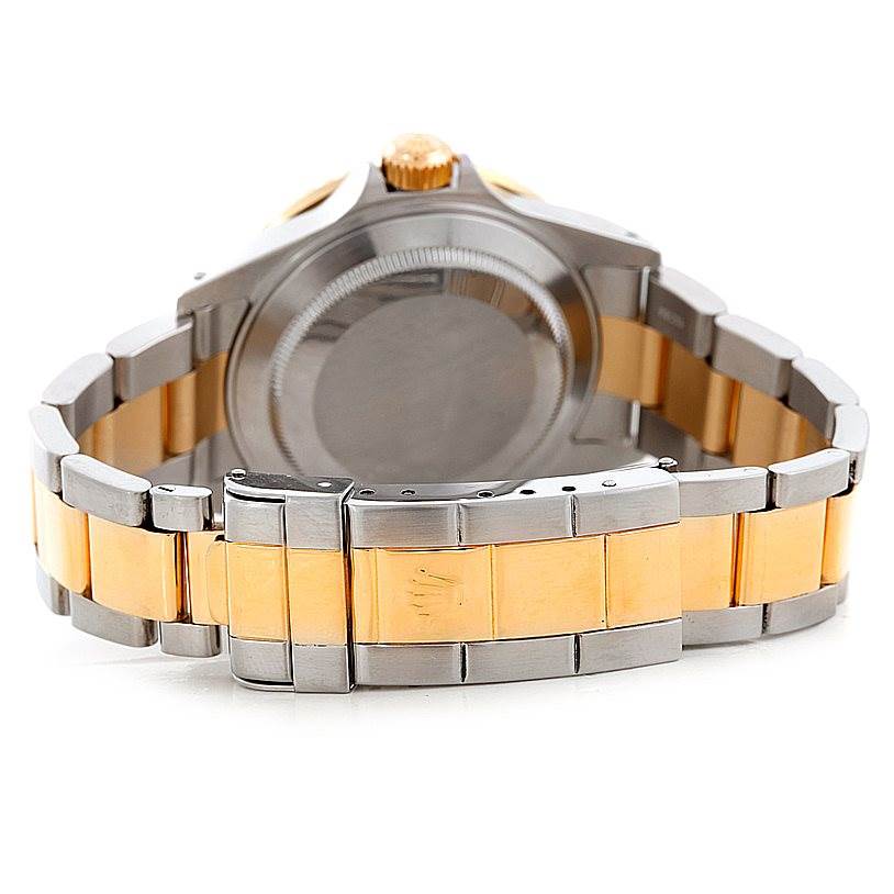 The image shows the back view of a Rolex Submariner 16613 Men's Steel and Gold (two tone) Champagne Dial 16613 Men's Steel and Gold (two tone) Champagne Dial watch, highlighting its bracelet and clasp, with the case back visible.